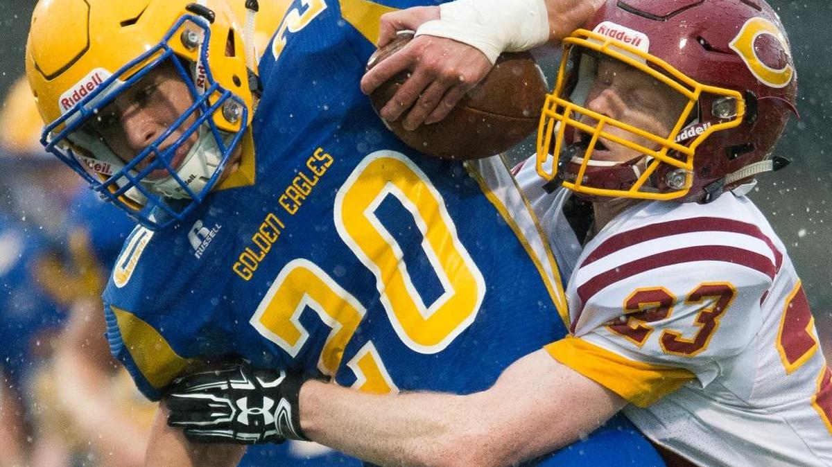 Ferndale’s Ben Broselle, left, fights through an attempted tackle by Capital’s Ryder Martin on Saturday, Nov. 5..