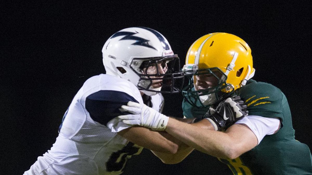 
Squalicum's Jacob Burgoon, left, looks to shed a block during a game against Lynden on Friday, Sept. 18, at Lynden High School in Lynden.
