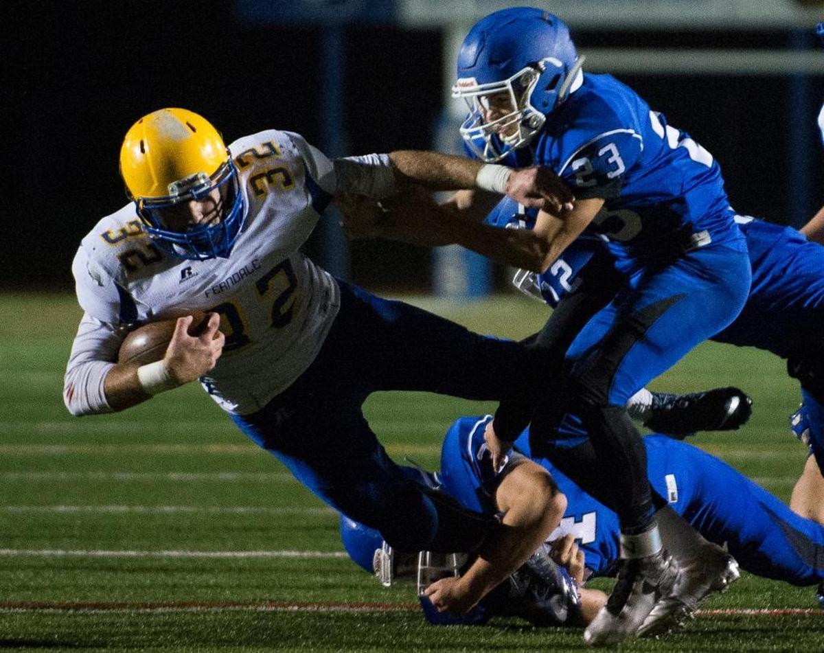 Ferndale's Austin Honeycutt drives through a pile of Sedro-Woolley defenders on Thursday, Oct. 29, at Sedro-Woolley High School.