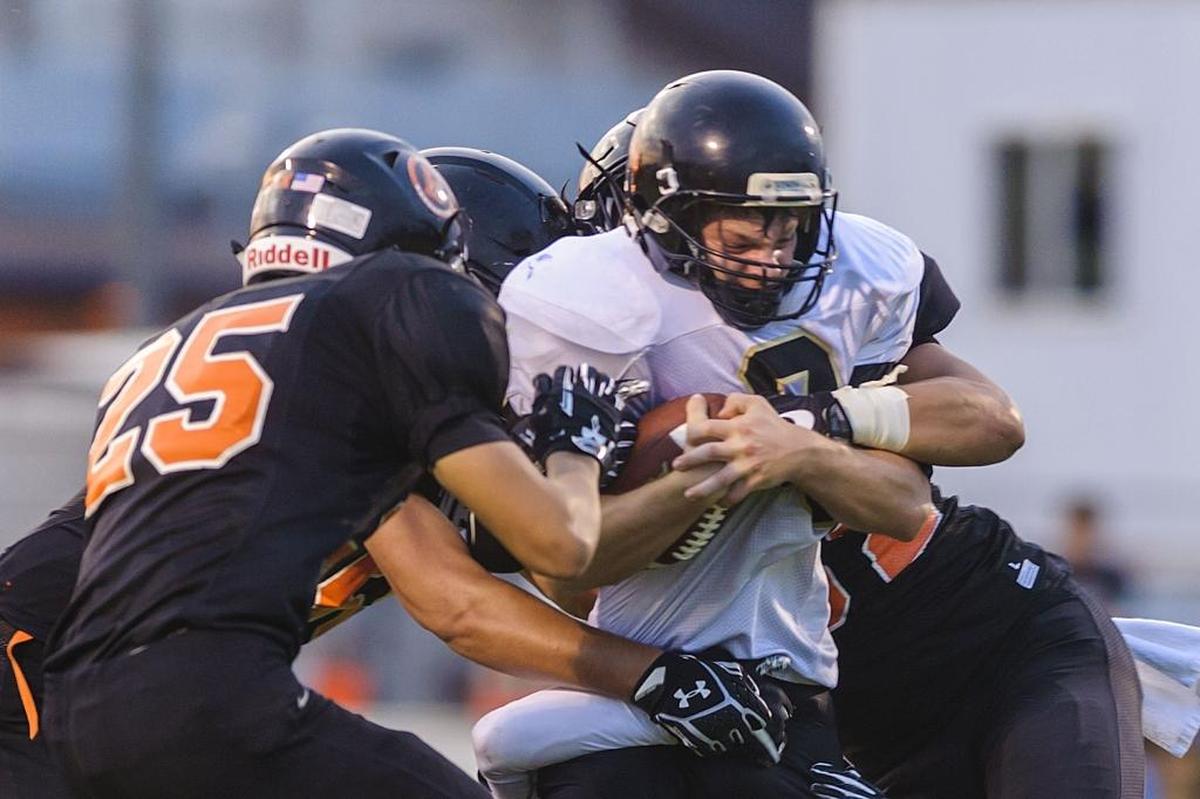 Meridian running back Bryce VandenHaak fights through a horde of Blaine defenders Sept. 8. VandenHaak leads Whatcom County with 305 yards receiving this year.