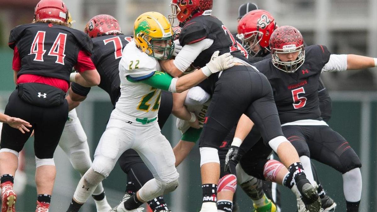 Lynden's Gage Bates makes a tackle during a playoff game against Archbishop Murphy Nov. 26 at Everett Memorial Stadium in Everett.