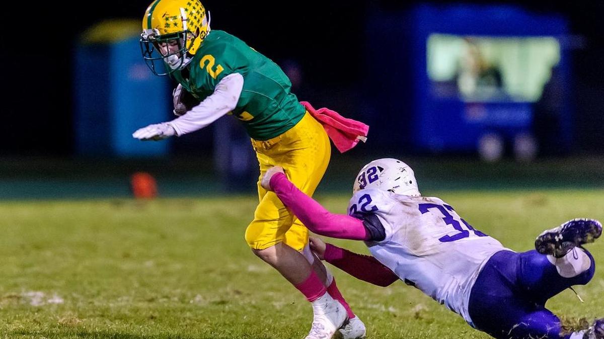 Anacortes defensiveman Peyton Beaner attempts to tackle Lynden wide receiver Kobe Elsner during the second quarter Friday, Oct. 13.