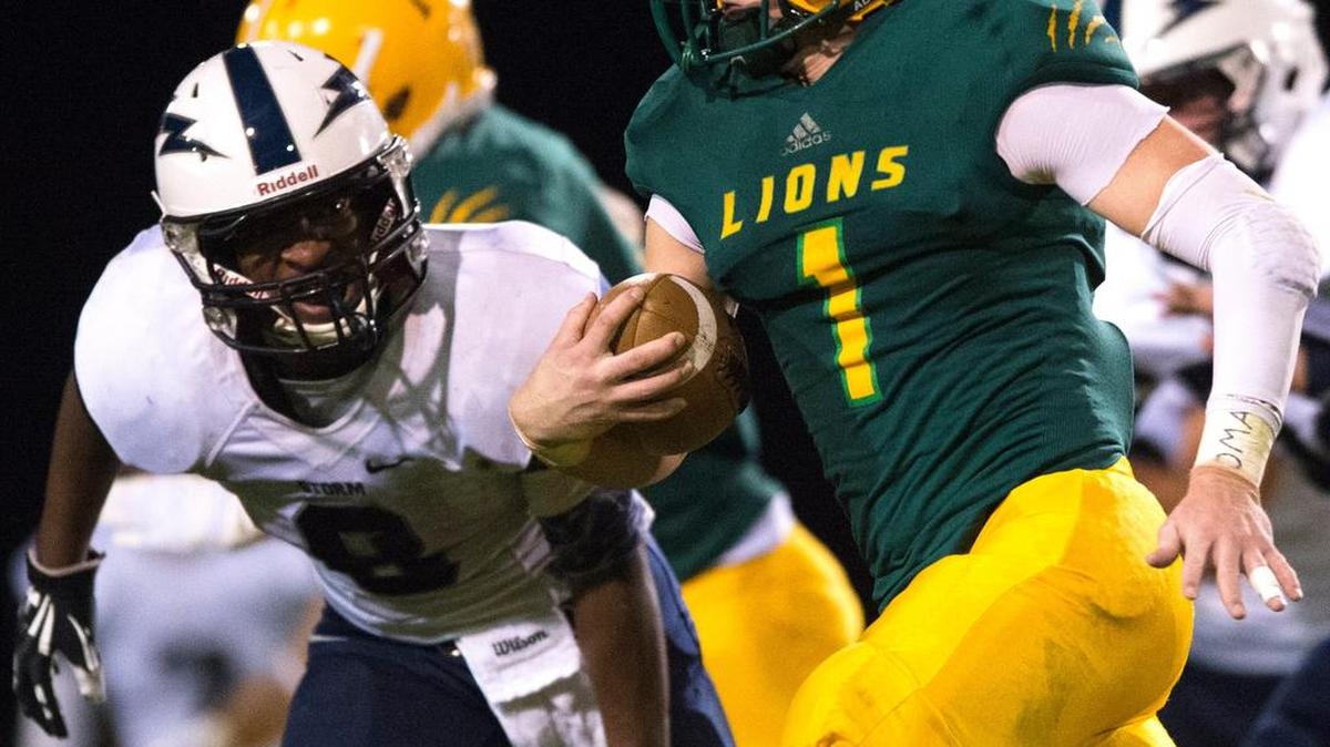 
Lynden's Jordan Wittenberg is pursued by Squalicum's Damek Mitchell on Friday, Sept. 18, at Lynden High School in Lynden.

