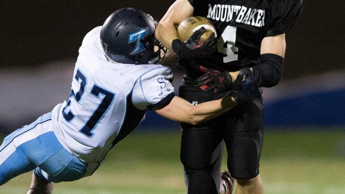 Mount Baker’s Jed Schleimer runs through an attempted tackle by Sultan’s Dalton Miller.
