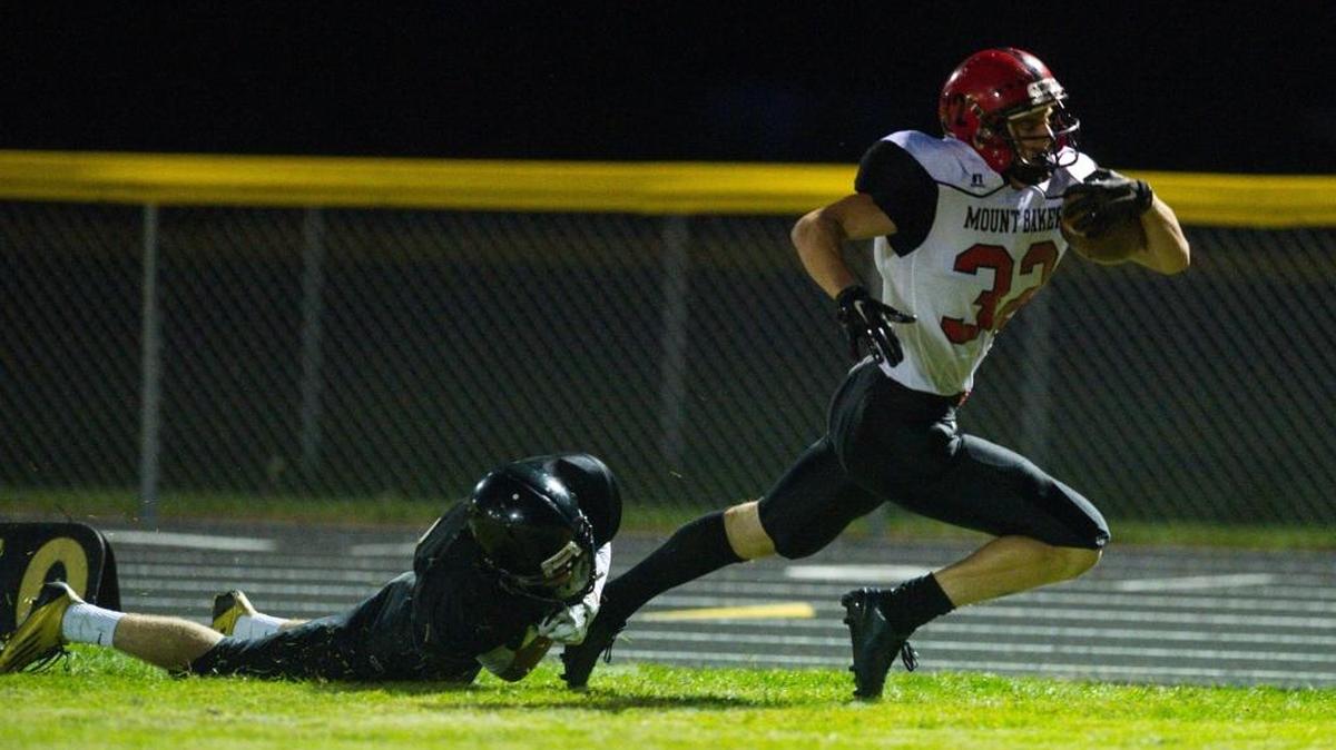 Mount Baker’s Thomas Barbo runs away from a Meridian defender during a Northwest Conference game Friday, Oct. 2, at Meridian High School.