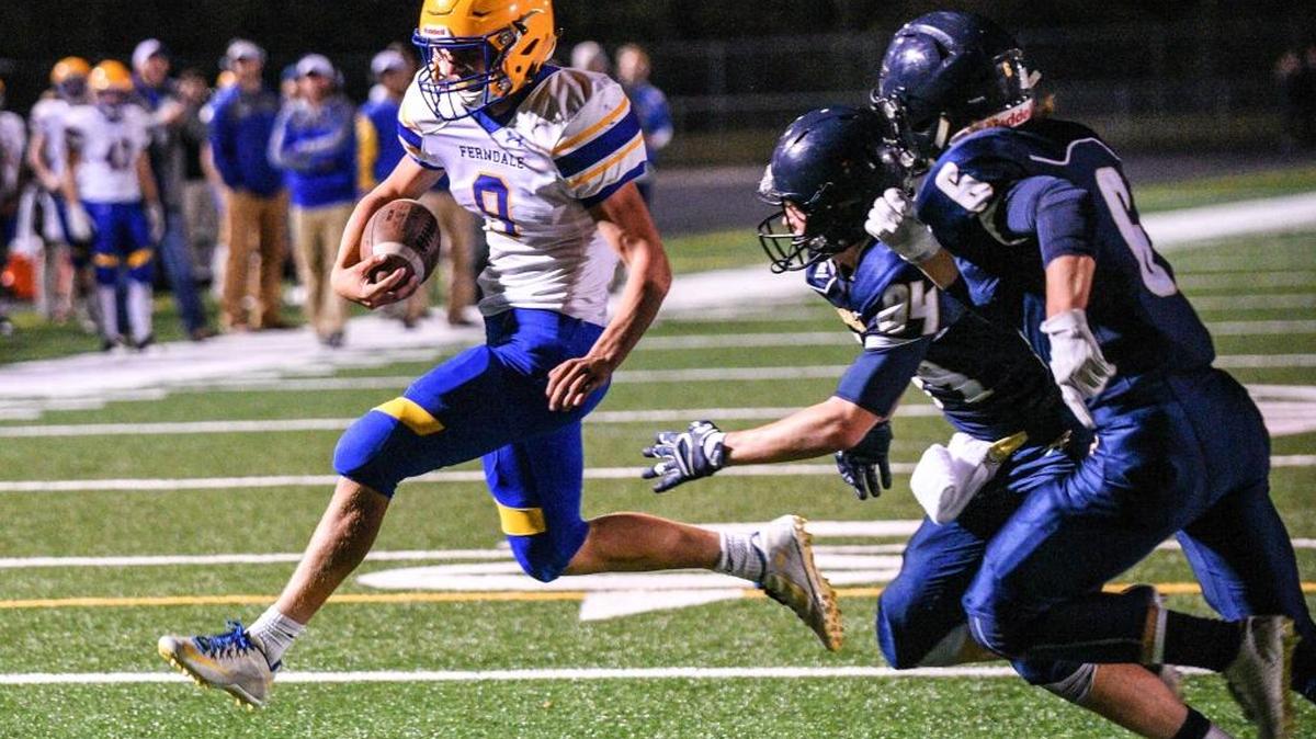Ferndale’s Justice Powell, left, scores a touchdown against Arlington Friday, Sept. 23.