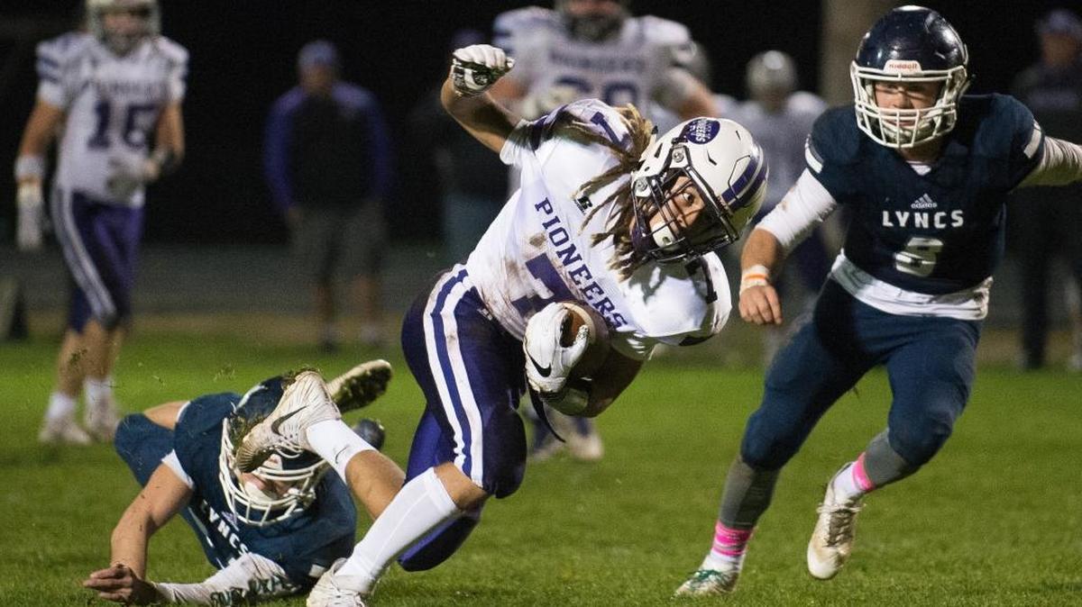 Nooksack Valley’s Evan Neitling breaks through the Lynden Christian defense for a touchdown on Friday, Oct. 27, at Lynden Christian High School. Nooksack Valley advances to the 1A Northwest District Playoffs with the win.