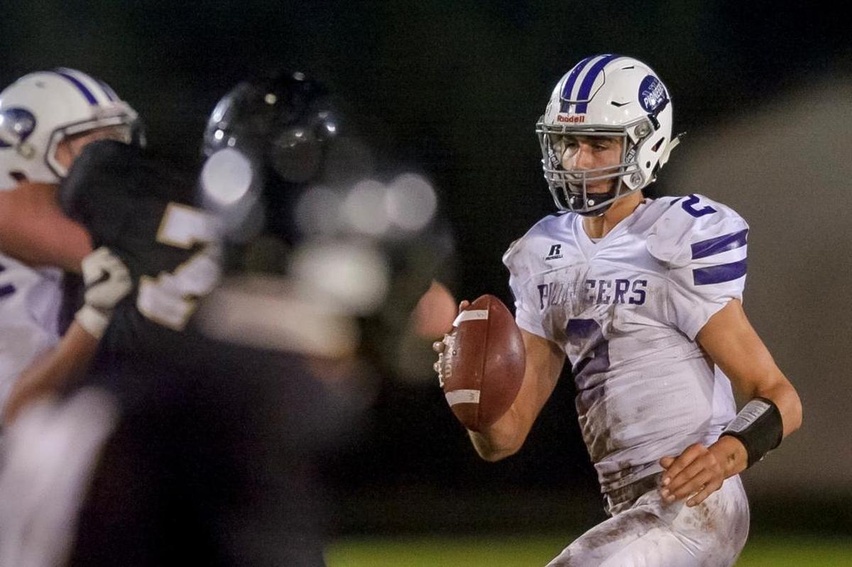 Nooksack Valley’s Casey Bauman looks for an open receiver during the second quarter on Oct. 21 against Meridian. Bauman leads Whatcom County with 567 yards passing this year.