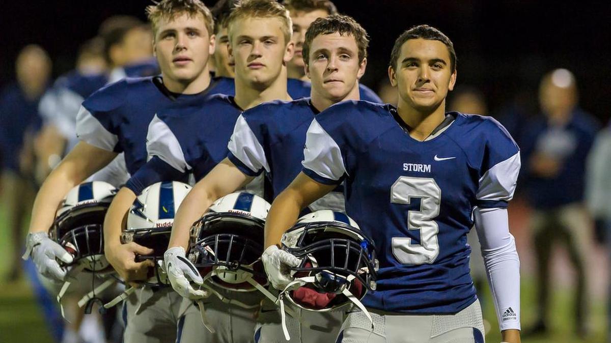 
The Squalicum footballl squad listens to the National Anthem before taking on Ferndale on Saturday evening Oct. 10, at Civic Field.
