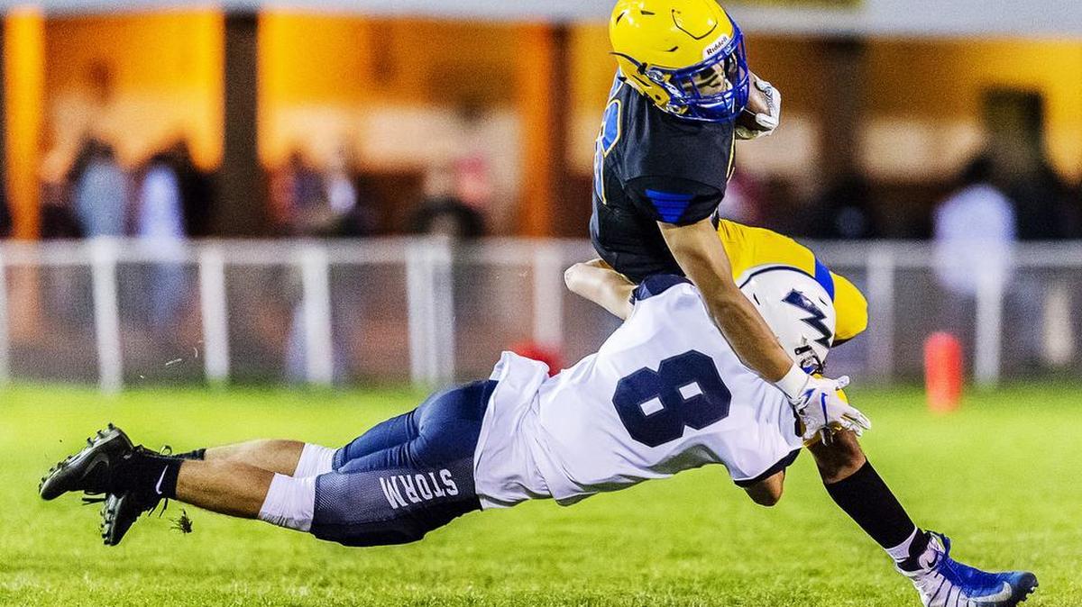 Squalicum’s Declan McGee (8) tackles Ferndale running back Tallen Williams (26) behind the line of scrimmage for a 5-yard loss during the first quarter Friday evening, Oct. 5, 2018, at Ferndale High School in Ferndale, Wash. Squalicum defeated Ferndale 28-14.