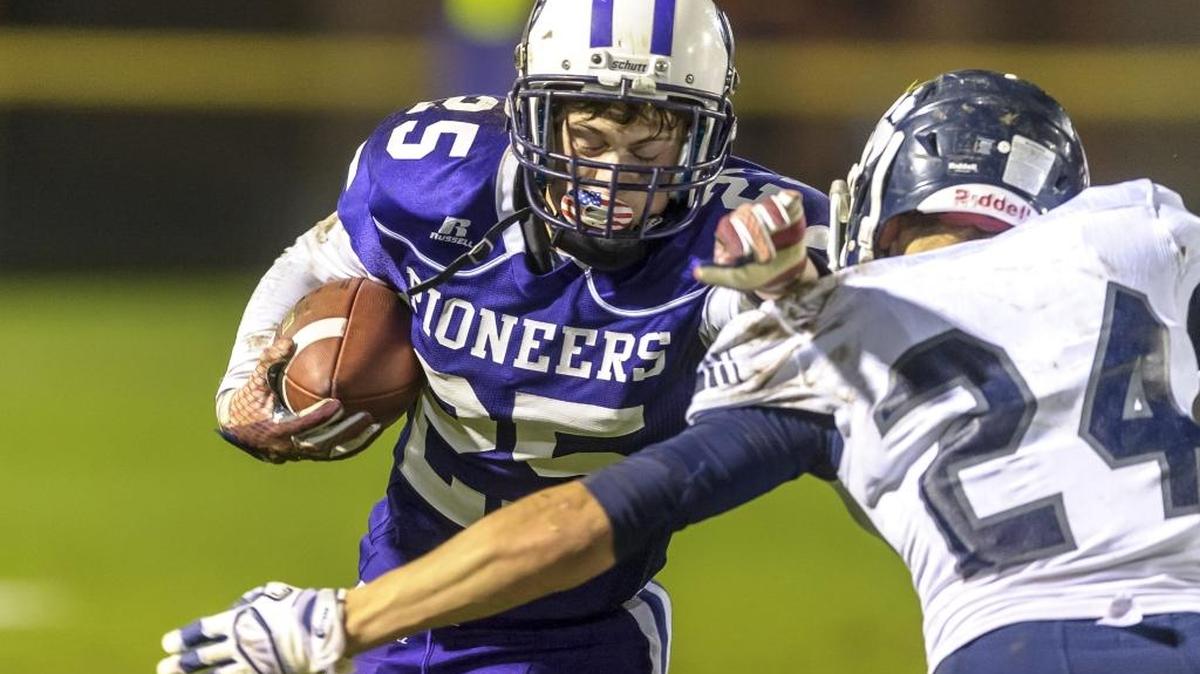 Nooksack Valley’s Tre Silva attempts to evade Lynden Christian’s Tyson Cline Oct. 28.