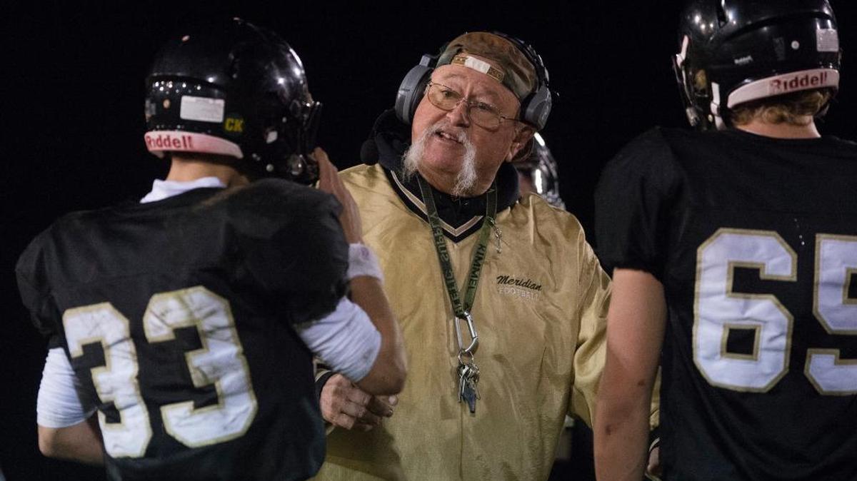 Meridian coach Bob Ames talks with his players during an Oct. 6 game against Mount Baker.