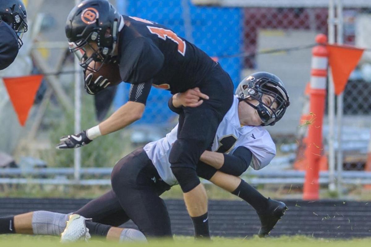 Blaine receiver Dalton Mouw tries to fight through the tackle of Meridian’s Dawson Logan Sept. 8. Mouw leads Whatcom County with 408 yards receiving through the first four weeks of the 2017 season.