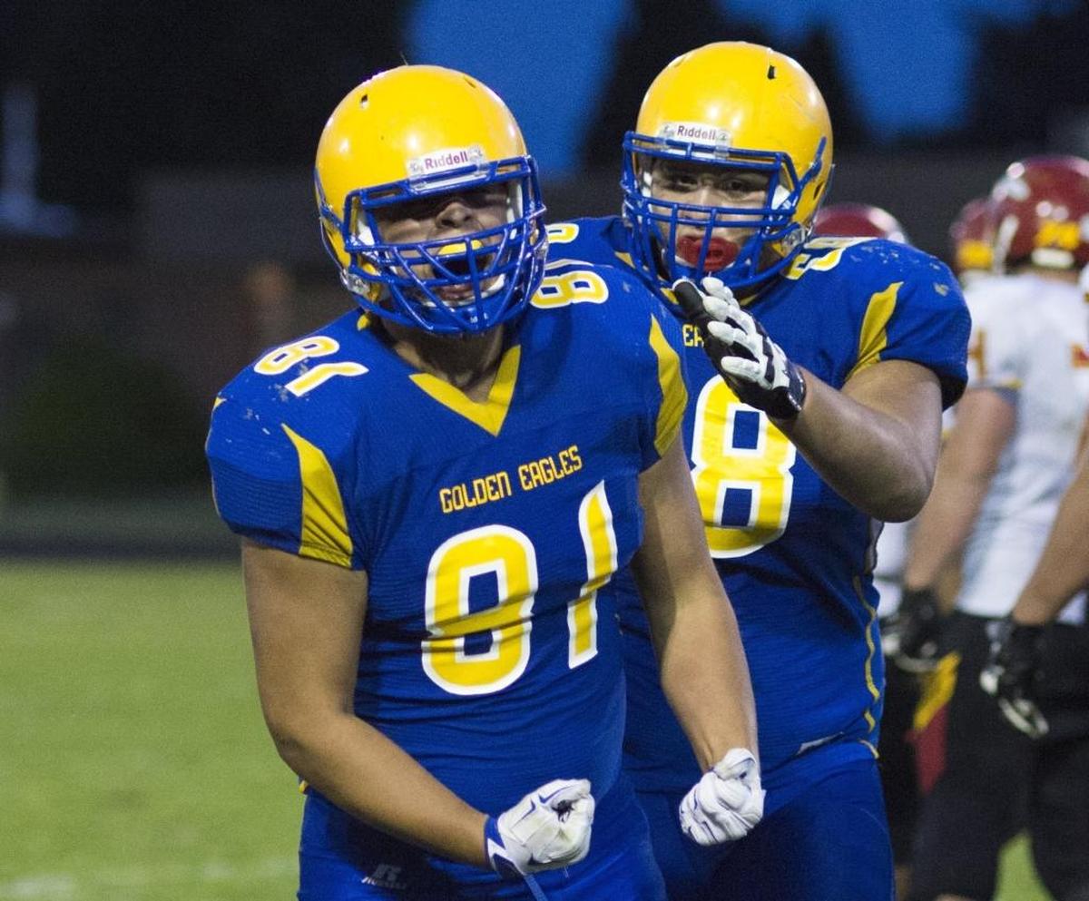 Winterhawk Leighton celebrates with teammate Chris Hernandez as Ferndale defeated Kamiakin 35-34 in overtime in Week 1.