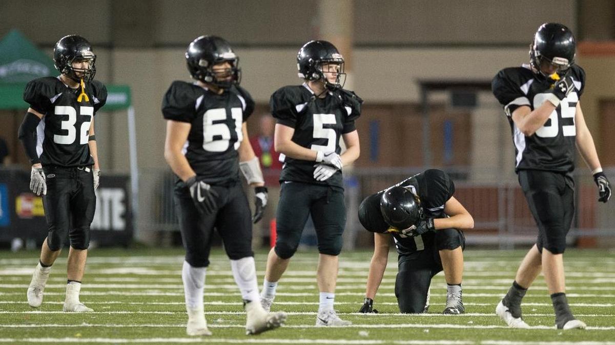Meridian players show their disappointment as they walk off the field after a 33-27 loss to Royal in the 1A state championship game Saturday, Nov. 2, at the Tacoma Dome.
