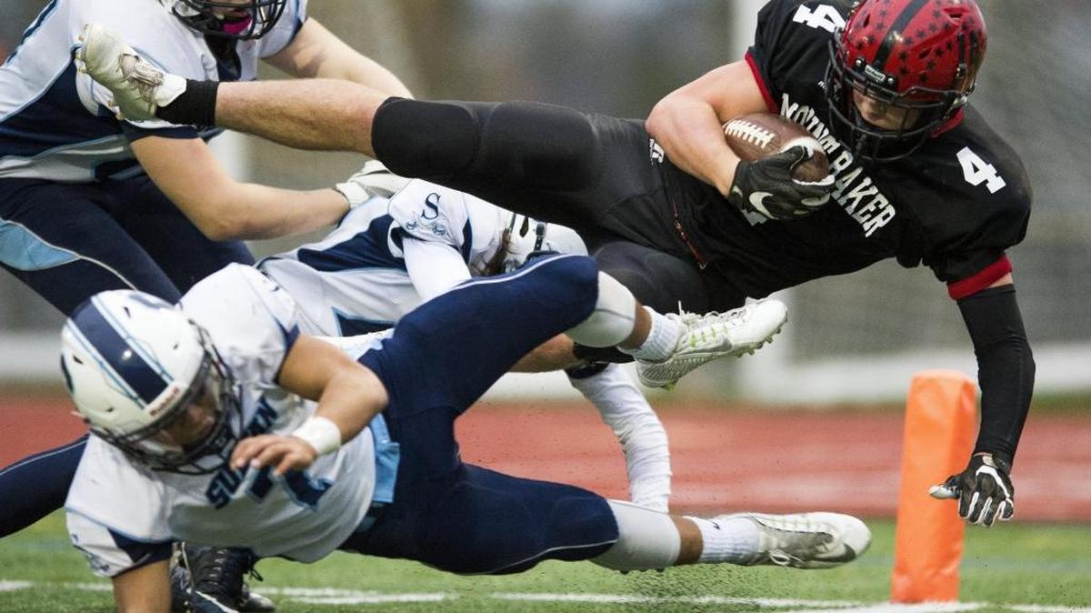 Mount Baker’s Jed Schleimer dives through Sultan defenders into the end zone for a touchdown in a Class 1A Northwest District playoff game Nov. 4 at Civic Stadium in Bellingham. Schleimer has been selected the All-Whatcom County Football Player of the Year.