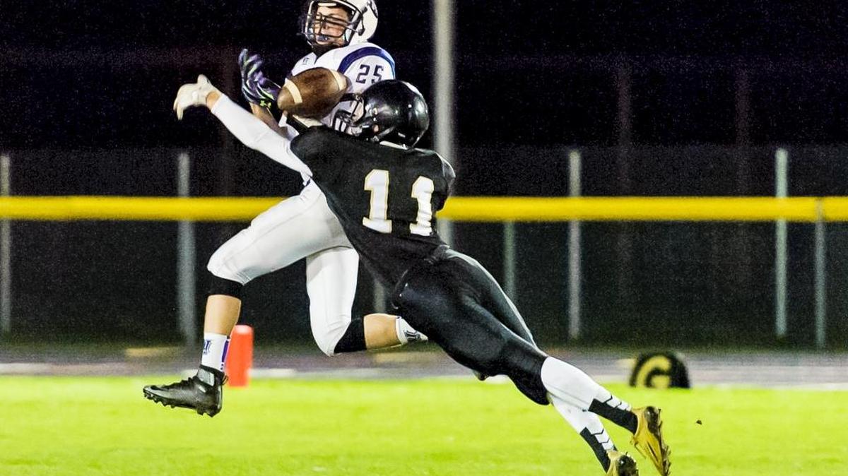 Meridian’s Alan Eyoub (11) breaks up a pass intended for Nooksack Valley's Tre Silva during the first quarter on Friday, Oct. 30.