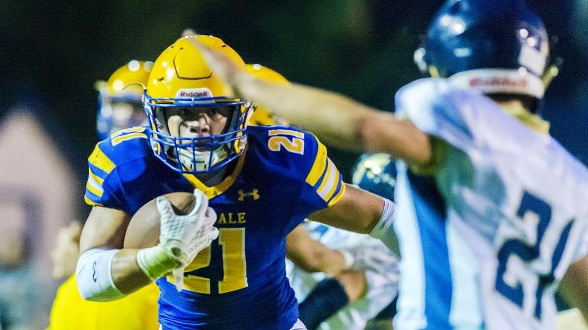 Ferndale running back Cole Semu looks for a way around Arlington defensive back Gerit Deberry, right, as he approaches the goal line during the first quarter Friday, Sept. 22. Semu scored one of his four touchdowns in the game.