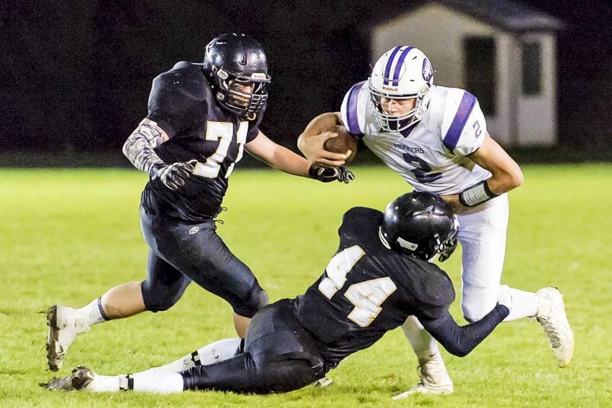 Nooksack Valley quarterback Casey Bauman (2) and the Pioneers play at South Whidbey on Friday, Nov. 7.