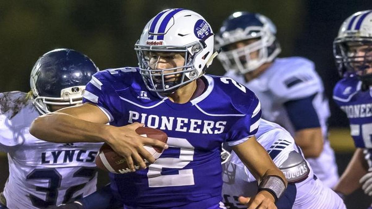Nooksack Valley's Casey Bauman (2) negotiates an opening in the Lynden Christian defensive line on Oct. 28. Bauman announced that he has committed to play football for Montana State beginning in the fall of 2018.