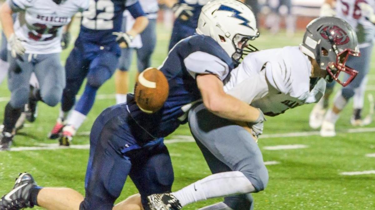 Squalicum’s Jack Wendling (44) causes a fumble while tackling W.F. West’s Hunter Fuchs (4) during the Class 2A State Playoffs on Saturday Nov. 14, at Civic Field in Bellingham.