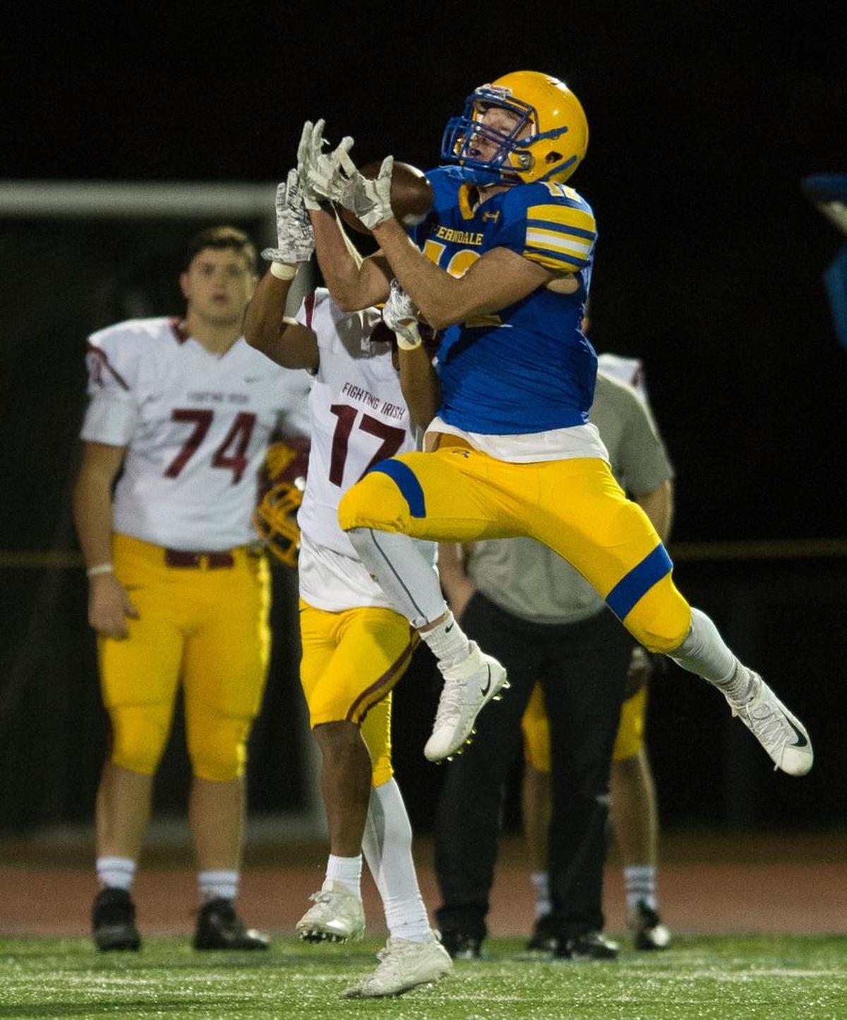 Ferndale’s Jared Emmert, right, intercepts a pass intended for O'Dea’s Cyrus Hunter in the Class 3A state quarterfinals on Friday, Nov. 17, at Civic Stadium in Bellingham. O'Dea defeated Ferndale 42-14.