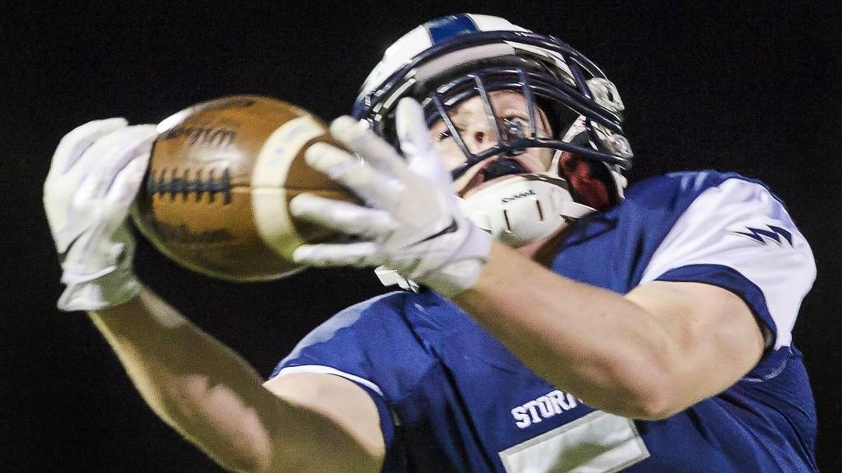 Squalicum wide receiver Ben Peterson stretches to catch a 20 yard pass from quarterback Garrett Sorenson for a first down late in the second quarter on Oct. 10.
