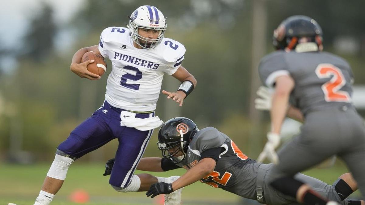 Nooksack Valley’s Casey Bauman looks to pick up yardage against Blaine in a Sept. 2 game.
