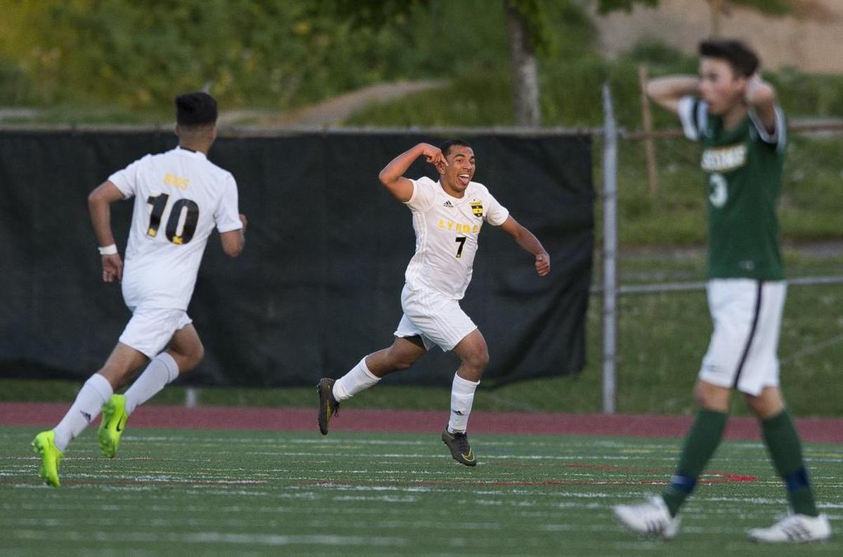 Lynden’s Nick Parris, center, celebrates after scoring a goal against Sehome 2-1 in the Class 2A Bi-District Tournament on May 6 at Civic Stadium in Bellingham. Parris was named to the Class 2A all-state team selected by coaches.