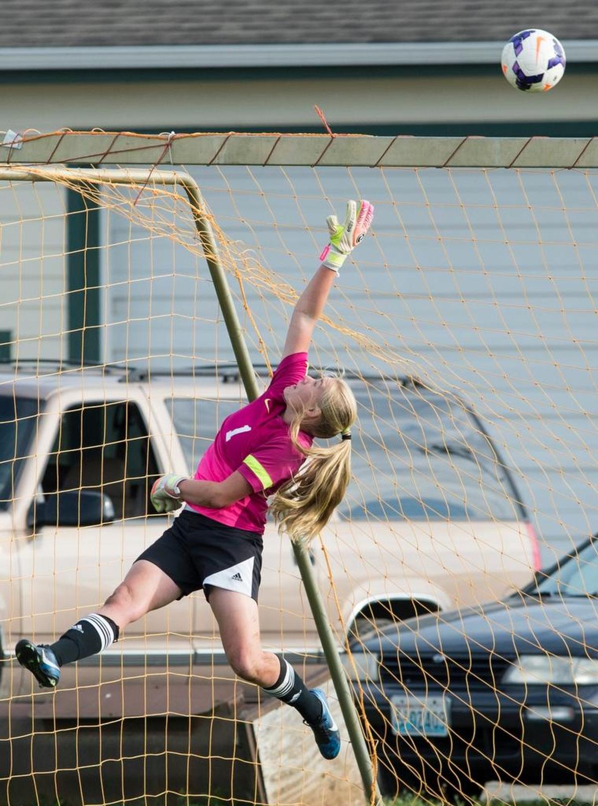 Meridian goalkeeper Sydney Gospodinovich deflects a ball over the crossbar in a 1-0 win over Lynden Thursday, Oct. 2, 2014 at Bender Fields in Lynden.