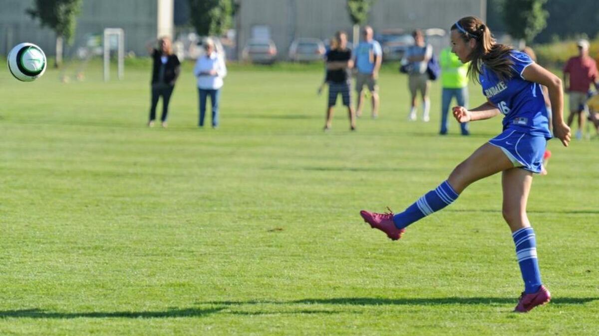 Ferndale’s JazLynn Ahrens kicks the ball down the field against Sehome in Sept. 2013. Ahrens signed to play for Whatcom Community College this fall.