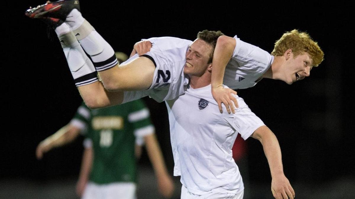 Squalicum's Carl Peterson is carried down the field by his teammate Ben Peterson after scoring the go-ahead goal in the second half during a 3-2 victory over Sehome on Tuesday at Civic Stadium in Bellingham.
