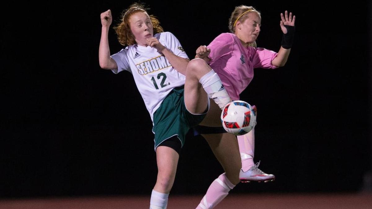 Sehome’s Gracey Henoch, left, and Squalicum’s Jessica DeVere battle for control of the ball during a 1-1 tie on Tuesday, Oct. 10, in Bellingham.
