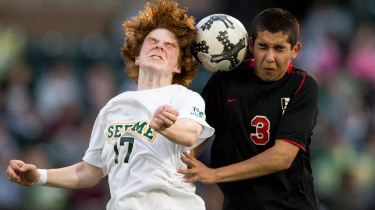 Sehome’s Seamus Trueb, left, and Bellingham’s Christian Ramos try to head the ball in a 1-1 draw on Thursday, April 20 at Civic Stadium in Bellingham.