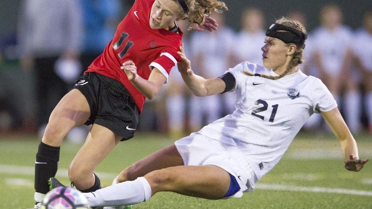 Squalicum’s Kendra Steele slide tackles Bellingham’s Jillian Langei on Sept. 20 at Civic Stadium in Bellingham. Steele has been selected The Bellingham Herald’s All-Whatcom County Girls Soccer Player of the Year.