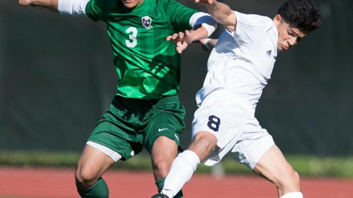 Squalicum’s Jonny Zavalza, right, abruptly changes directions with the ball to spin behind Edmonds-Woodway’s Chien Ung on Saturday, May 6, at Civic Stadium in Bellingham. Squalicum won 2-0 to move on in the 2017 District 1 3A Boys Soccer Tournament.