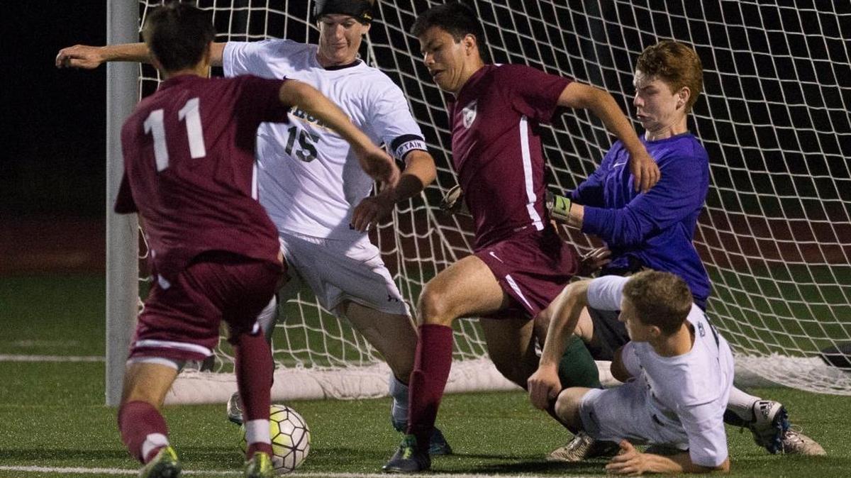 Sehome's Gabe Weight, Kiefer Thomas and goalkeeper Devin Trueb work together to prevent a goal with under two minutes left Tuesday, May 10, at Civic Stadium.