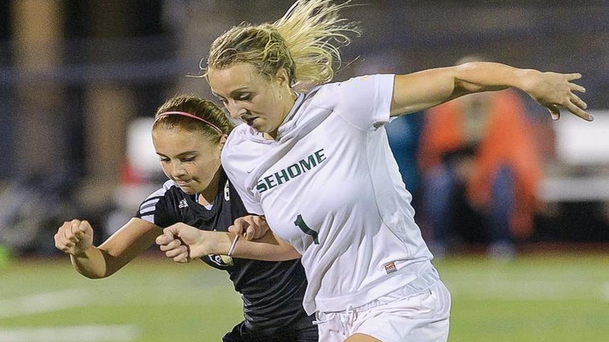 Meridian's Micaela Pimento (6) battles with Sehome's Christina Funk for possession during the second half in varsity girls' soccer on Thursday evening Oct. 8, at Civic Stadium in Bellingham, Wash. Sehome defeated Meridian 2-0.
