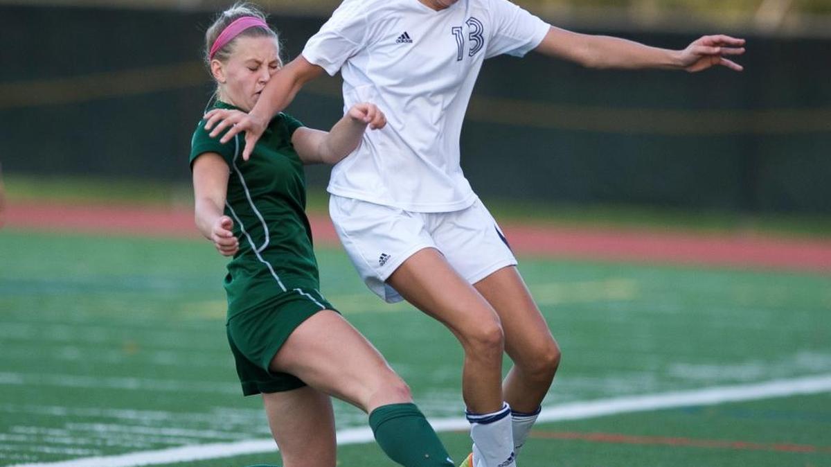 Lynden Christian's Isabella Hernandez takes the ball from Bear Creek's Madison Baugh during a Class 1A Bi-District Tournament girls' soccer game on Tuesday, Nov. 3, at Civic Stadium.