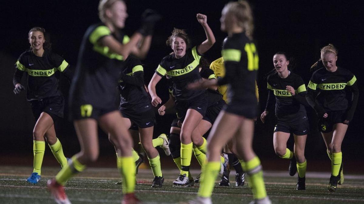 Lynden celebrates during a 3-2 victory over Sehome in a winner-to-state game Thursday at Sedro-Woolley.