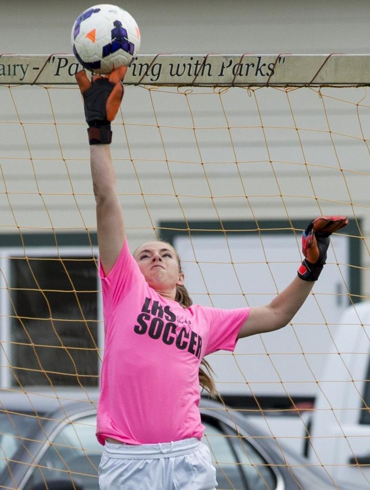 Lynden's Emily Holt makes a save during a game against Meridian at Bender Fields on Thursday, Oct. 2, 2014 at Bender Fields in Lynden.