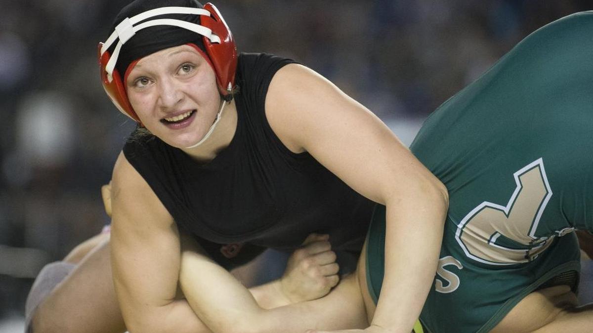 Mount Baker’s Emma Bruntil looks toward the crowd a moment after pinning Redmond’s Nadia Medvinsky in the girls 135-pound championship match at Mat Classic XXIX Feb. 18 at the Tacoma Dome. Bruntil was selected The Bellingham Herald’s All-Whatcom County Girls Wrestler of the Year.