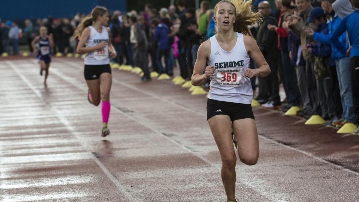 Sehome's Abby Johnson crosses the finish line at the 2014 Northwest Conference Cross Country Championships at Civic Stadium. Johnson has been selected a recipient of the Birger Solberg Scholarship.