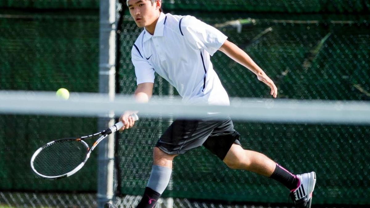 
Sehome's Henry Han lunges after the ball during a doubles match against Anacortes on Wednesday, Sept. 23, at Sehome High School in Bellingham.
