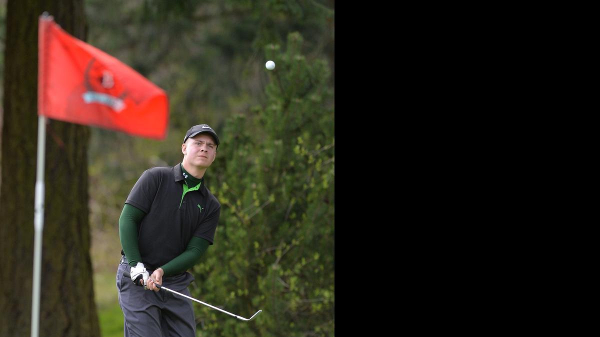 
Lynden's Ezra Arneson watches his chip shot to the hole at the 2014 Birger Solberg Golf Tournament held at Bellingham Golf and Country Club on Thursday, March 27, 2014 in Bellingham. 
