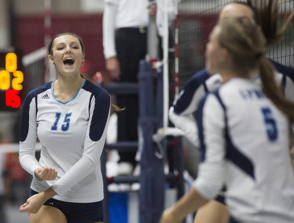 Lynden Christian's Kara Bajema (15) celebrates with teammates after winning the first set against Montesano in their first-round at the Class 1A state volleyball tournament on Friday, Nov. 13, 2015, at the Yakima Valley SunDome in Yakima, Wash.