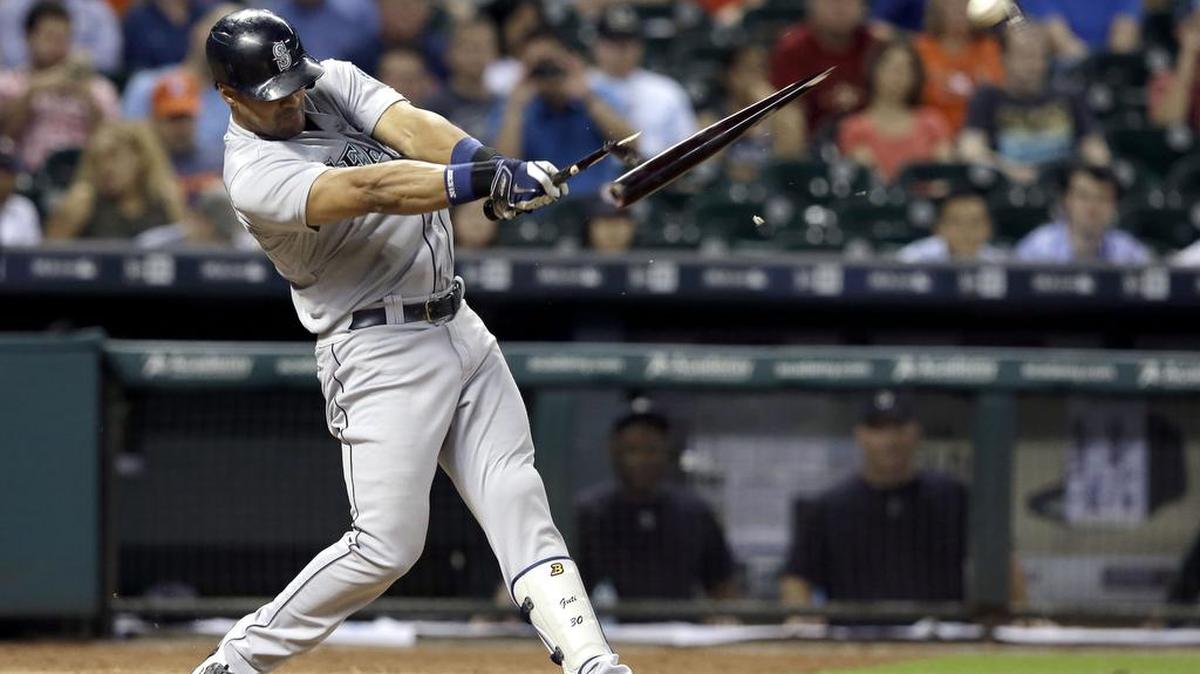 
Seattle’s Franklin Gutierrez breaks his bat on a single to center field against the Houston Astros during the ninth inning Wednesday in Houston.
