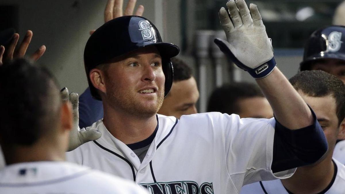 
Mark Trumbo greets his Mariners teammates after a home run July 24 against the Blue Jays. 
