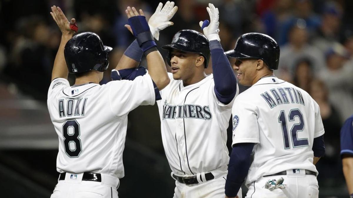 Seattle Mariners Ketel Marte, right, Norichika Aoki (8) and Leonys Martin (12) have played important parts on a team that has surged to the top of the AL West.