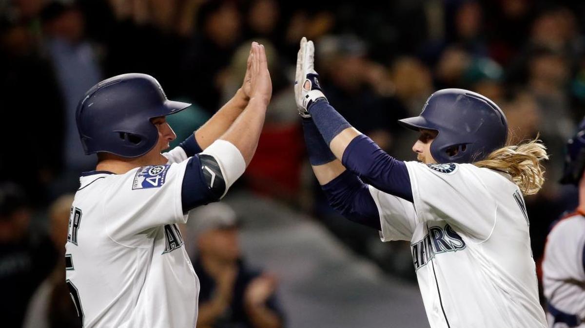 Seattle’s Taylor Motter, right, is met by Kyle Seager at home on his home run against Houston in the third inning Wednesday.